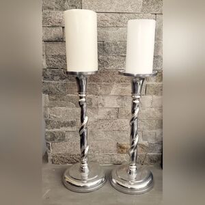 A Pair Of Silver Pillar Candle Holders Twisted Stem Design Round Base Tall